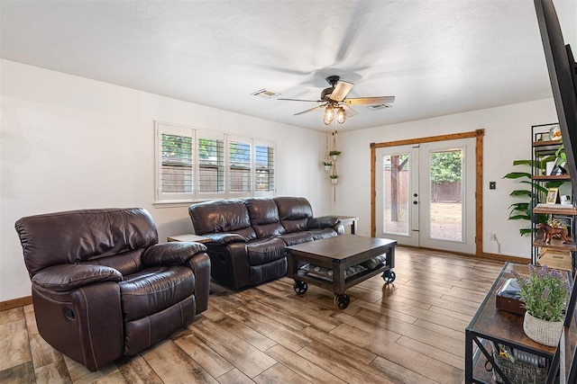 1113 Winnipeg Dr, Yukon, OK 73099 - living room with a ceiling fan, plenty of natural light, wood finished floors, and french doors