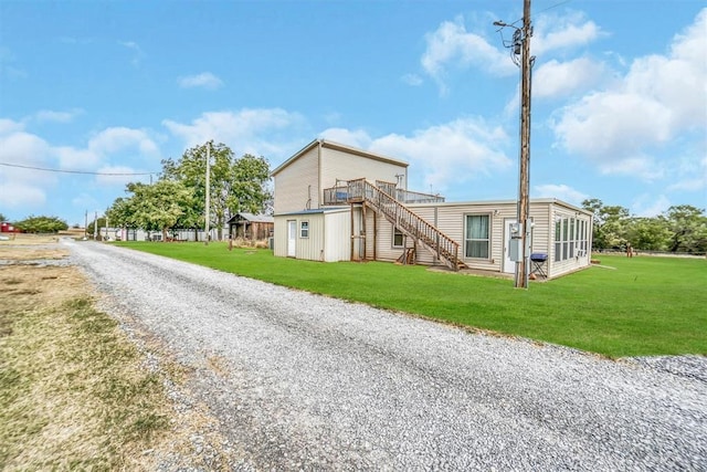 23596 Beach Haven Dr, Granite, OK 73547 - view of home's exterior featuring stairs, driveway, a wooden deck, and a yard