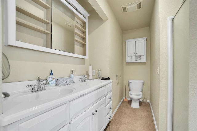 23596 Beach Haven Dr, Granite, OK 73547 - bathroom featuring double vanity, toilet, and baseboards