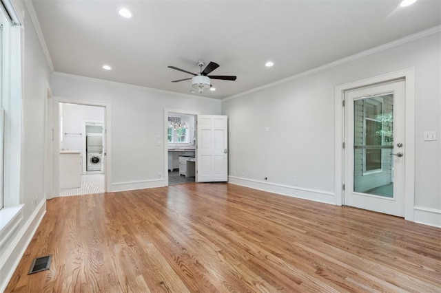 430 W Symmes St, Norman, OK 73069 - unfurnished living room featuring ornamental molding, recessed lighting, a ceiling fan, baseboards, and light wood-style flooring