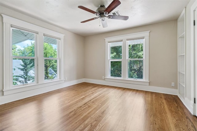 430 W Symmes St, Norman, OK 73069 - unfurnished room featuring light wood-type flooring, a ceiling fan, and baseboards