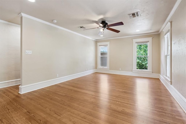 430 W Symmes St, Norman, OK 73069 - empty room featuring wood finished floors, a ceiling fan, baseboards, ornamental molding, and a smoke detector