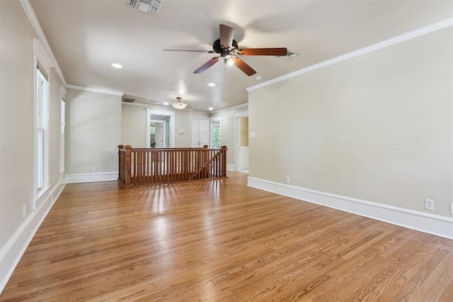 430 W Symmes St, Norman, OK 73069 - spare room featuring light wood-style floors, a ceiling fan, crown molding, recessed lighting, and baseboards