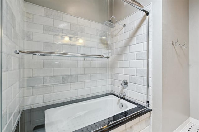 430 W Symmes St, Norman, OK 73069 - bathroom with tiled shower / bath combo and baseboards