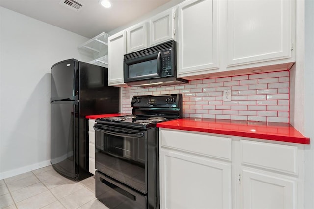 430 W Symmes St, Norman, OK 73069 - kitchen with black appliances, decorative backsplash, white cabinets, light tile patterned flooring, and baseboards