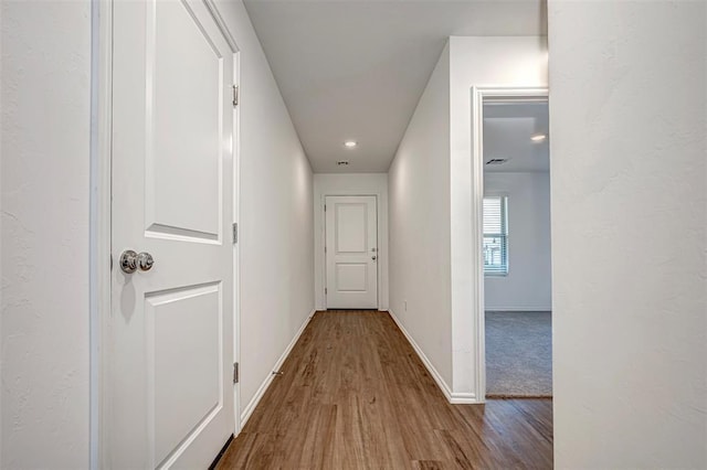 3717 Palmetto Bluff Dr, Mustang, OK 73064 - hallway featuring wood finished floors and baseboards