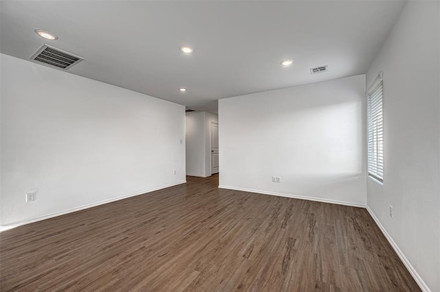 3717 Palmetto Bluff Dr, Mustang, OK 73064 - spare room with dark wood-style flooring, recessed lighting, and baseboards