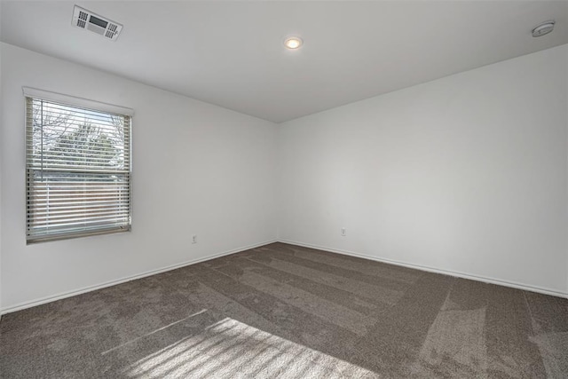 3717 Palmetto Bluff Dr, Mustang, OK 73064 - spare room featuring dark colored carpet, baseboards, and a smoke detector