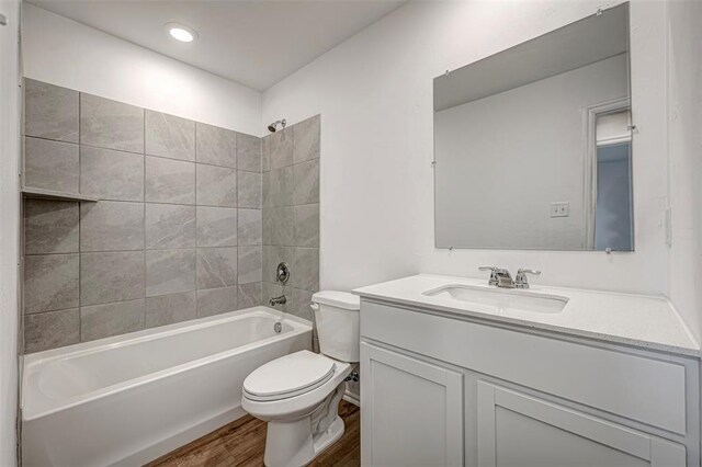 3717 Palmetto Bluff Dr, Mustang, OK 73064 - bathroom with toilet, wood finished floors, vanity, and shower / bath combination