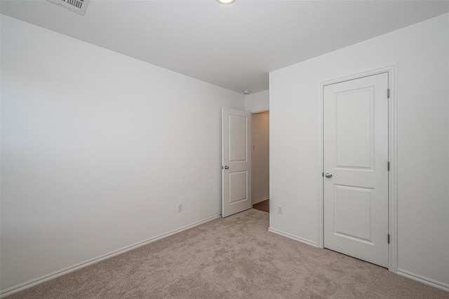3717 Palmetto Bluff Dr, Mustang, OK 73064 - unfurnished bedroom featuring light carpet and baseboards