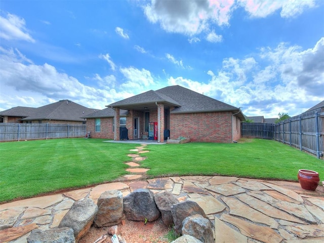 15508 Homecoming Dr, Edmond, OK 73013 - rear view of house featuring brick siding, a patio area, and roof with shingles