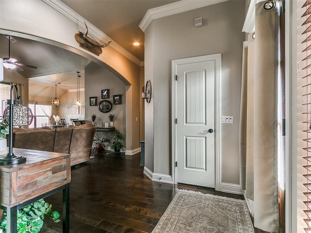 15508 Homecoming Dr, Edmond, OK 73013 - entryway with ceiling fan, arched walkways, baseboards, dark wood finished floors, and crown molding