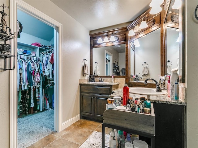 15508 Homecoming Dr, Edmond, OK 73013 - full bath featuring tile patterned flooring, vanity, a walk in closet, and baseboards