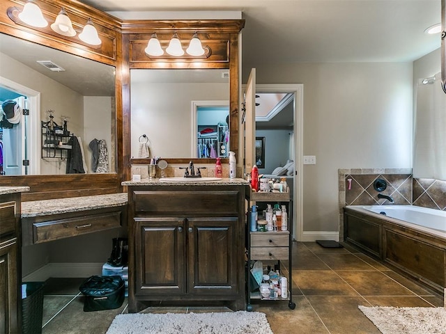 15508 Homecoming Dr, Edmond, OK 73013 - bathroom with a bath, vanity, tile patterned floors, a spacious closet, and baseboards