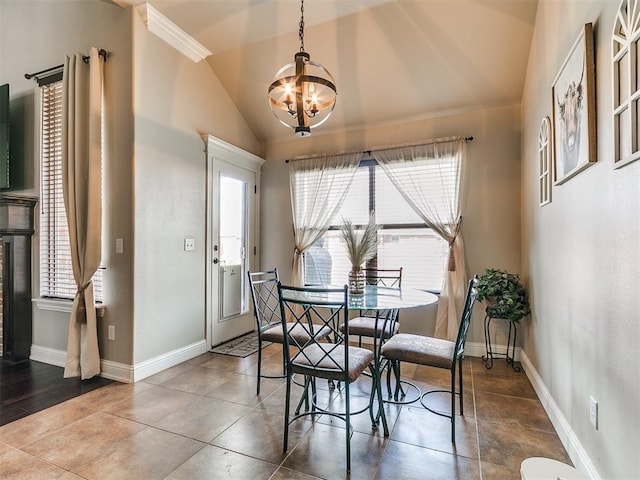 15508 Homecoming Dr, Edmond, OK 73013 - dining room with a chandelier, baseboards, and vaulted ceiling