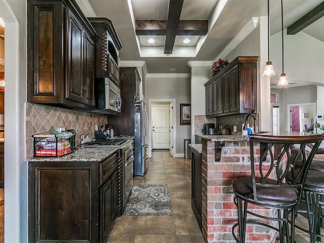15508 Homecoming Dr, Edmond, OK 73013 - kitchen with stainless steel appliances, beam ceiling, a breakfast bar area, stone counters, and backsplash