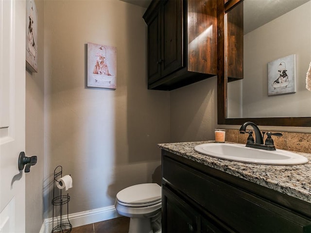 15508 Homecoming Dr, Edmond, OK 73013 - half bathroom featuring vanity, toilet, baseboards, and tile patterned floors