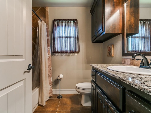 15508 Homecoming Dr, Edmond, OK 73013 - bathroom with vanity, baseboards, toilet, tile patterned flooring, and shower / tub combo