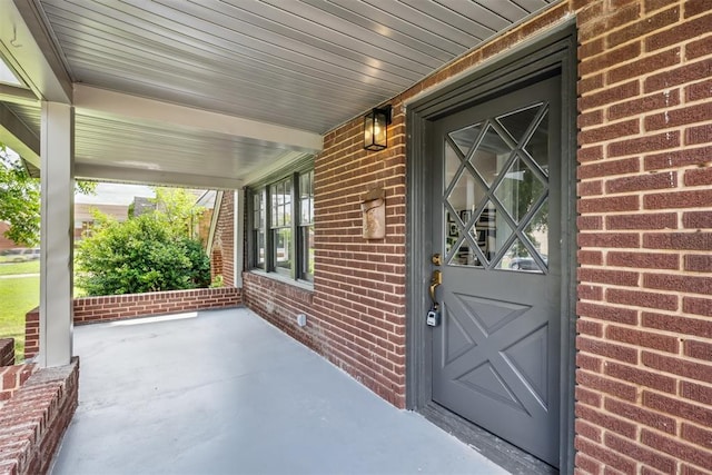 938 NE 21st St, Oklahoma City, OK 73105 - view of exterior entry with covered porch and brick siding
