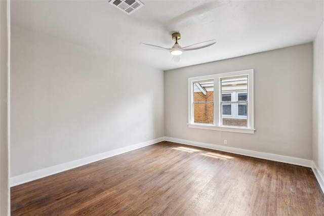 938 NE 21st St, Oklahoma City, OK 73105 - spare room featuring baseboards, a ceiling fan, and wood finished floors