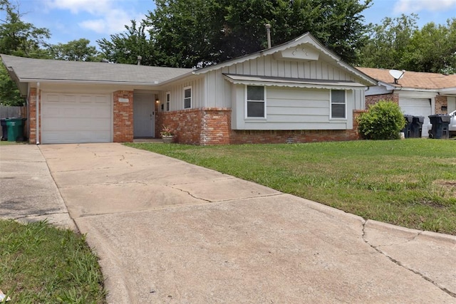 1221 NW 101st St, Oklahoma City, OK 73114 - ranch-style house with brick siding, board and batten siding, concrete driveway, an attached garage, and a front lawn