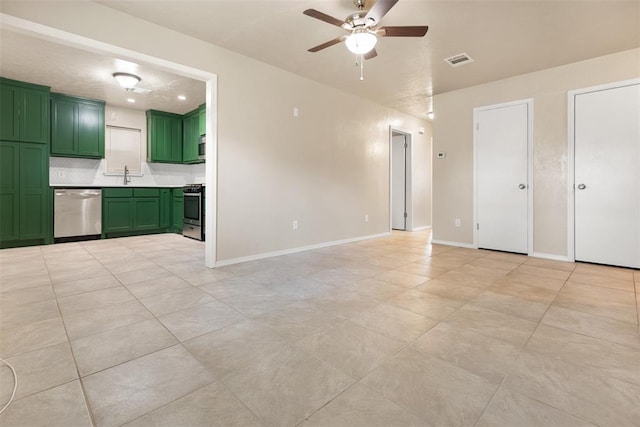 1221 NW 101st St, Oklahoma City, OK 73114 - unfurnished living room with a sink, a ceiling fan, light tile patterned floors, and baseboards