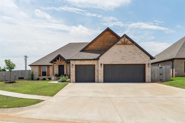 4442 Violet St, Tuttle, OK 73089 - view of front of property with brick siding, a garage, driveway, and roof with shingles