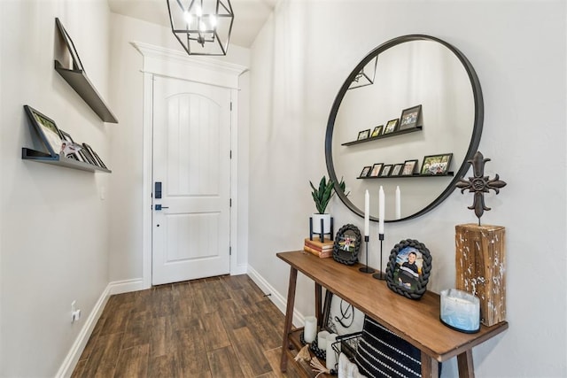 4442 Violet St, Tuttle, OK 73089 - foyer with dark wood-style flooring, baseboards, and a chandelier