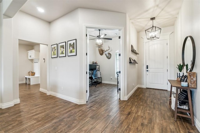 4442 Violet St, Tuttle, OK 73089 - entryway with dark wood-style floors, ceiling fan, baseboards, and a chandelier