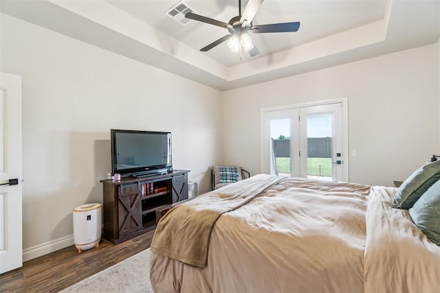 4442 Violet St, Tuttle, OK 73089 - bedroom with a raised ceiling, access to exterior, dark wood-type flooring, baseboards, and a ceiling fan