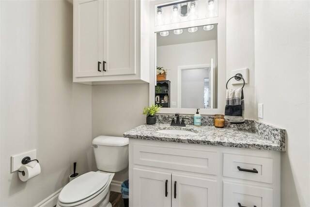 4442 Violet St, Tuttle, OK 73089 - half bathroom with vanity, toilet, and baseboards