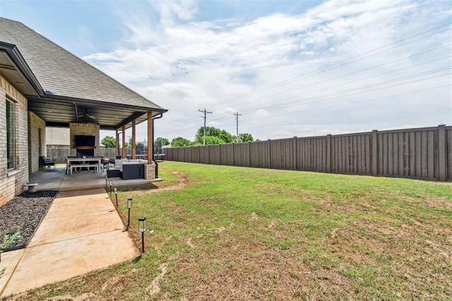 4442 Violet St, Tuttle, OK 73089 - view of yard featuring an outdoor living space with a fireplace, a patio area, and ceiling fan
