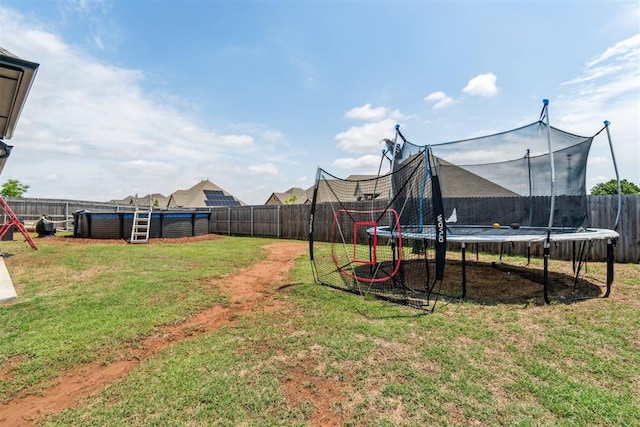 4442 Violet St, Tuttle, OK 73089 - view of yard featuring a trampoline