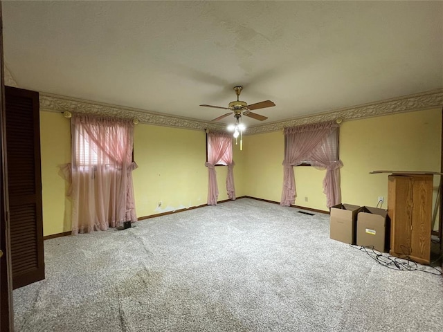 403 NW 3rd St, Minco, OK 73059 - unfurnished bedroom with carpet flooring, baseboards, and ceiling fan