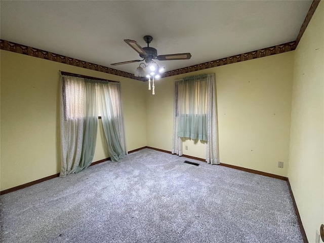 403 NW 3rd St, Minco, OK 73059 - empty room featuring ceiling fan, carpet floors, and baseboards