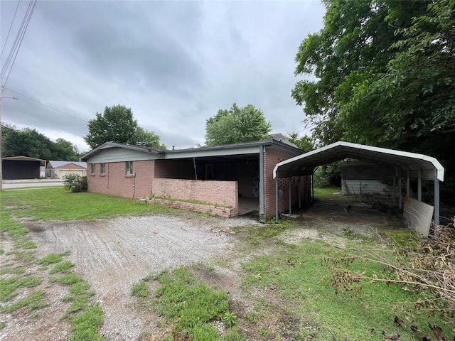 403 NW 3rd St, Minco, OK 73059 - view of outdoor structure featuring a carport
