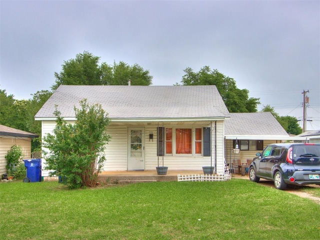 2133 SW 46th St, Oklahoma City, OK 73119 - view of front facade featuring a porch and a front lawn