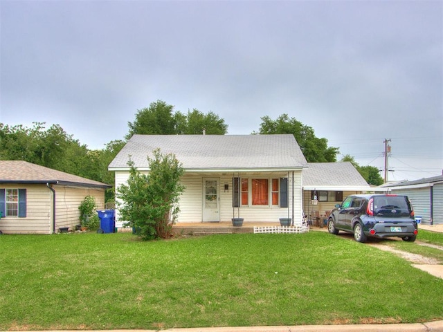 2133 SW 46th St, Oklahoma City, OK 73119 - view of front of home with a porch and a front lawn