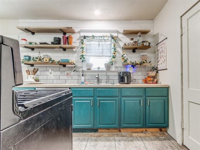 2133 SW 46th St, Oklahoma City, OK 73119 - kitchen featuring open shelves, a sink, and light countertops