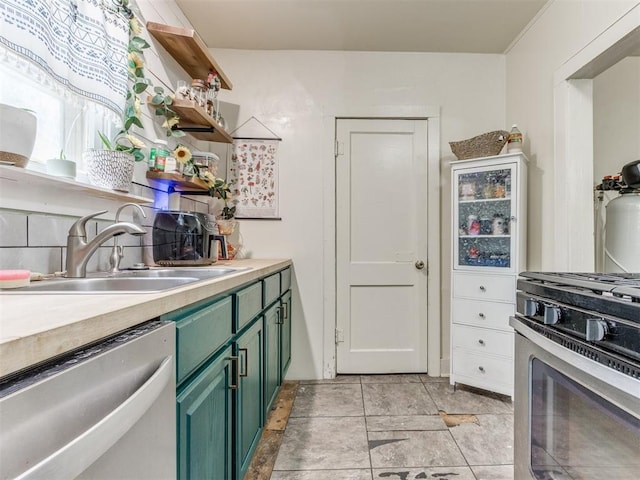 2133 SW 46th St, Oklahoma City, OK 73119 - kitchen with green cabinetry, stainless steel appliances, light countertops, a sink, and open shelves