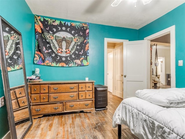 2133 SW 46th St, Oklahoma City, OK 73119 - bedroom with wood finished floors and a ceiling fan