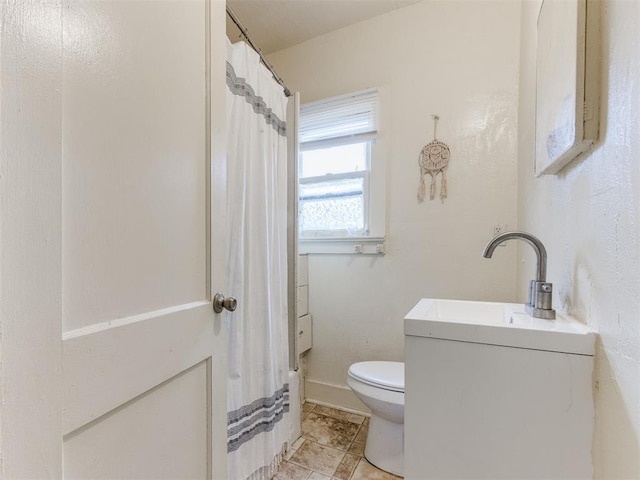 2133 SW 46th St, Oklahoma City, OK 73119 - bathroom featuring toilet, vanity, baseboards, and curtained shower