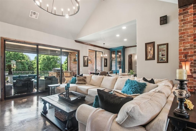 5813 Tiger Stone Dr, Mustang, OK 73064 - living room with high vaulted ceiling, a chandelier, concrete floors, and recessed lighting