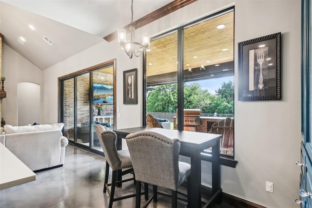 5813 Tiger Stone Dr, Mustang, OK 73064 - dining space with a chandelier, finished concrete floors, vaulted ceiling, and recessed lighting