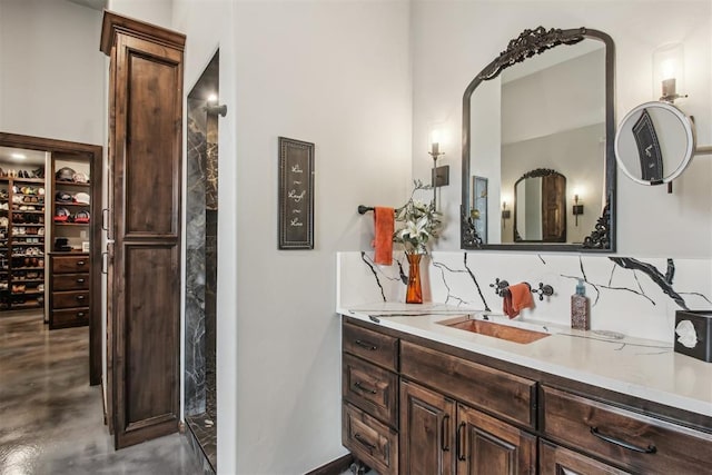 5813 Tiger Stone Dr, Mustang, OK 73064 - bathroom featuring vanity, backsplash, and finished concrete floors