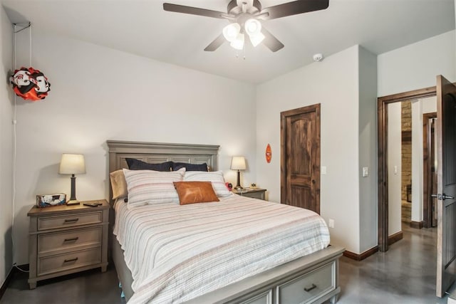 5813 Tiger Stone Dr, Mustang, OK 73064 - bedroom featuring baseboards, concrete floors, and ceiling fan
