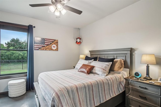 5813 Tiger Stone Dr, Mustang, OK 73064 - bedroom with ceiling fan and concrete floors