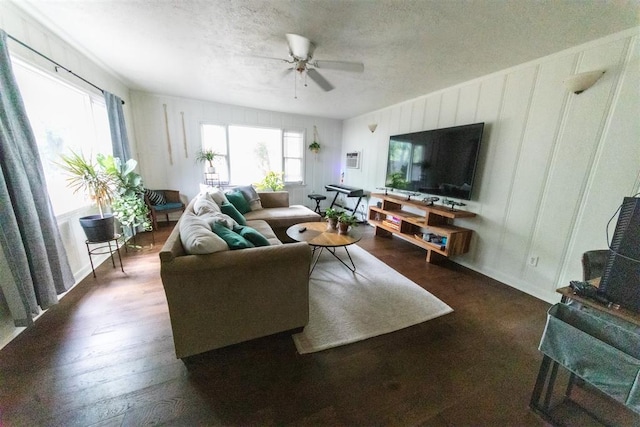 2616 NW 33rd St, Oklahoma City, OK 73112 - living room featuring ceiling fan, wood finished floors, a textured ceiling, and a decorative wall