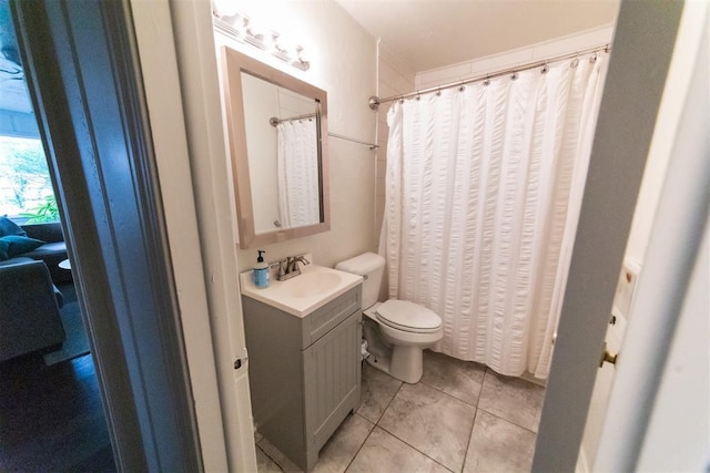 2616 NW 33rd St, Oklahoma City, OK 73112 - bathroom with vanity, toilet, and tile patterned floors