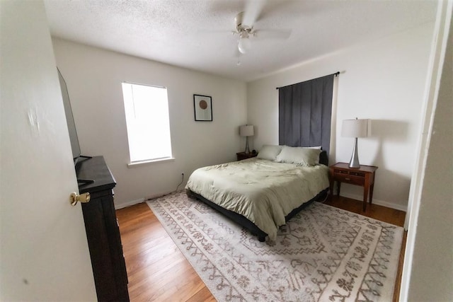 2616 NW 33rd St, Oklahoma City, OK 73112 - bedroom with wood finished floors, ceiling fan, and baseboards